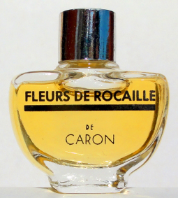 CARON fleurs de rocaille p 2ml bc argent pleine sans boite ancienne